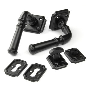 May include: Black metal door handle set with a lever handle, a square escutcheon, a latch, a strike plate, and two keyhole escutcheons.