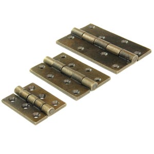 May include: Three antique brass-effect hinges of different sizes are displayed against a white backdrop. Each hinge features a rectangular plate with rounded corners and several screw holes. The hinges are open, showing the cylindrical barrel.