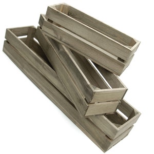 May include: Three wooden crates stacked on top of each other. The crates are made of natural wood and have a rustic look.