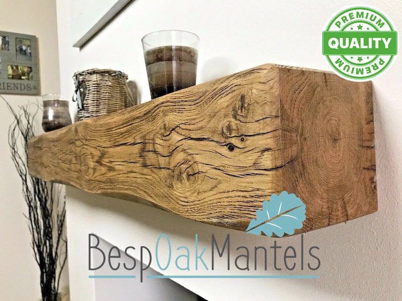 May include: A rustic wooden shelf with a natural wood finish. The shelf is mounted on a white wall and has a few items on it, including a glass jar, a wicker basket, and a glass vase. The shelf is labeled "Bespoak Mantels" and has a "Premium Quality" sticker on the right side.