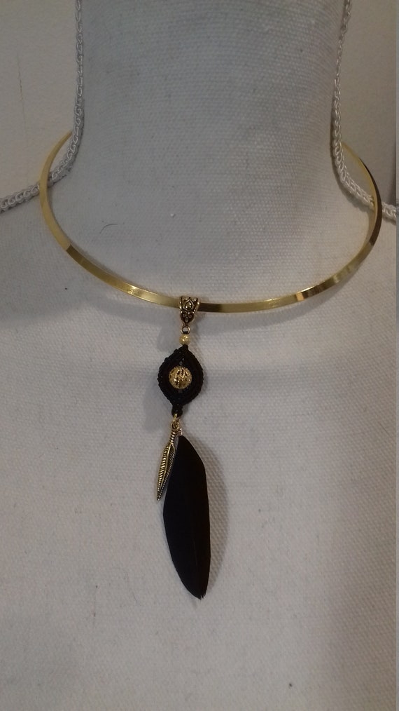 Golden torque necklace in micro macrame and goose feather