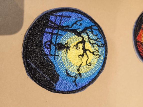 round iron-on patch to stick or sew nocturnal cat