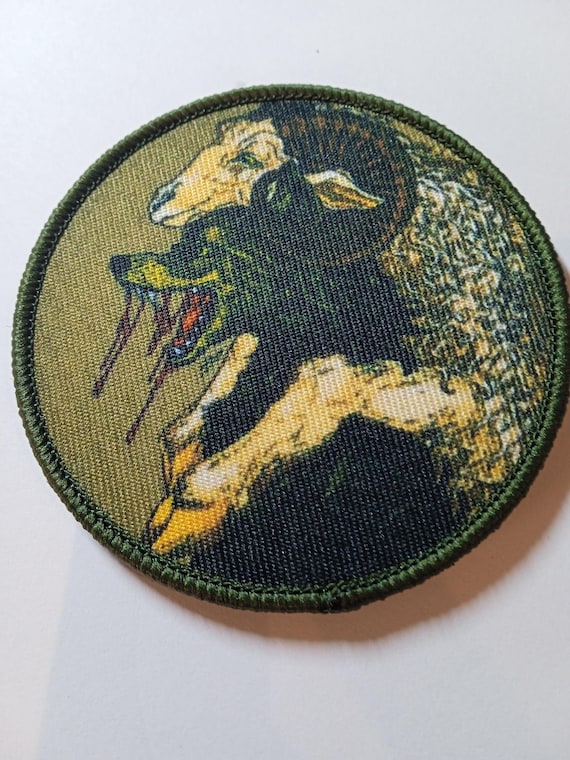 round scratch badge the wolf and the goat