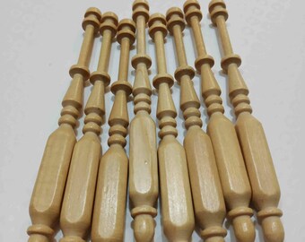 May include: A set of ten wooden bobbins for lace making. The bobbins are natural wood color and have a smooth, polished finish.