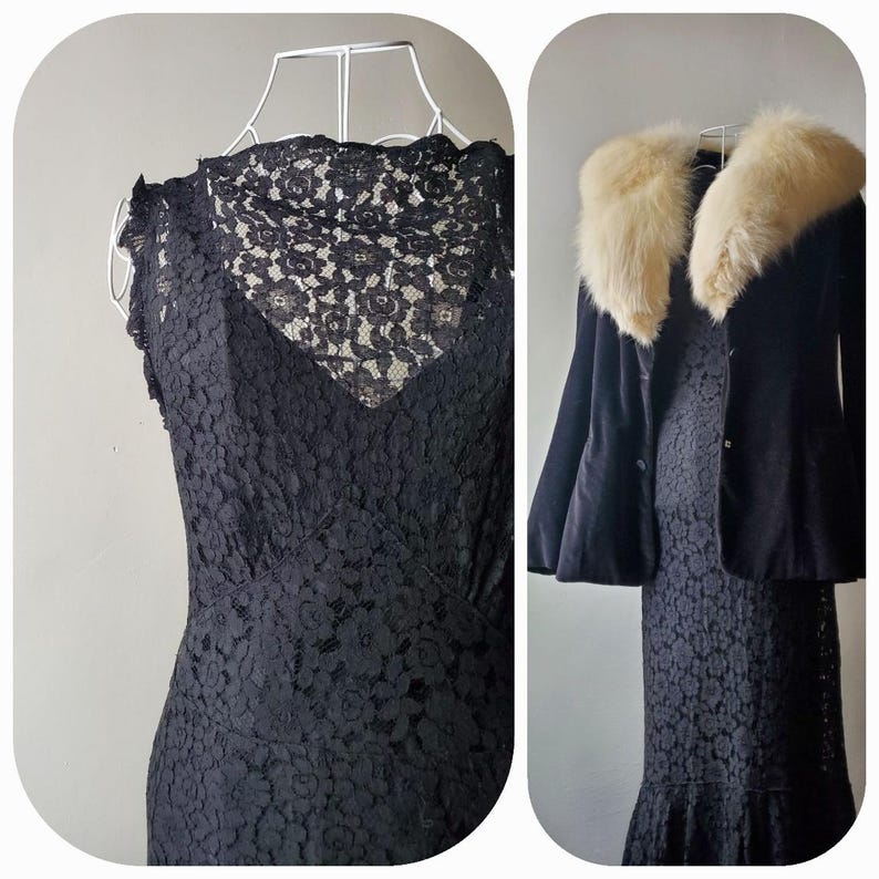 May include: A black lace dress with a V-neck and cap sleeves is displayed on a white hanger. Next to it is a black jacket with a cream-colored fur collar, also on a hanger. The dress has a fitted silhouette.