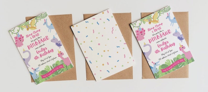 May include: Three birthday invitations with dinosaur graphics and the text "Stomp Chomp & Roar, let's party like a Dinosaur". The invitations are on brown envelopes, with a white background. The invitations have a pink, purple, and blue color scheme.