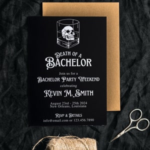 May include: Black bachelor party invitation with white text and a skull graphic in a glass. The invitation reads "Death of a Bachelor" and includes event details for Kevin M. Smith in New Orleans.