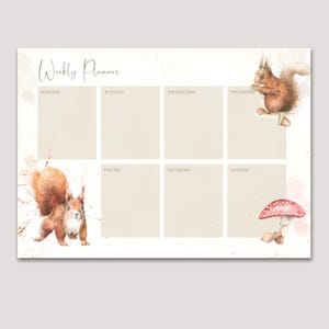 May include: A weekly planner with a watercolour design. The planner has a light beige background with the words "Weekly Planner" at the top. Two squirrels and a mushroom are illustrated on the planner. The days of the week are listed in the boxes.
