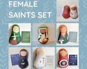 May include: Set of six handmade felt female saint dolls. Each doll is dressed in colorful clothing and has a prayer card. The saints include St. Joan of Arc, St. Therese of Lisieux, St. Bernadette, St. Clare of Assisi, St. Lucy, and Our Lady of Guadalupe.