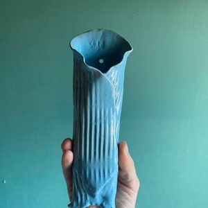 Vase for flowers on the wall