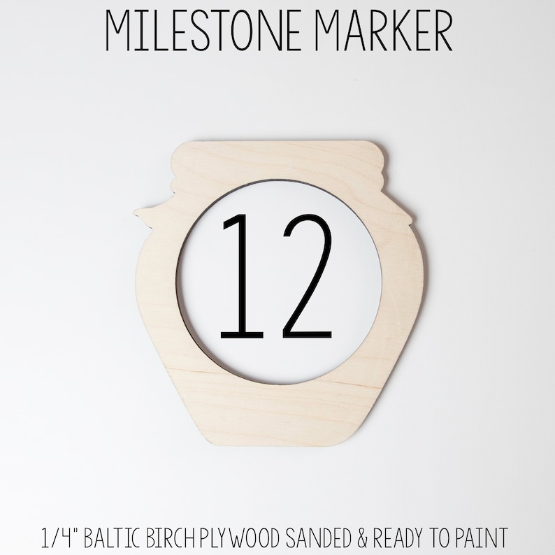 May include: Wooden milestone marker shaped like a jar with the number 12 in the center. The marker is made of 1/4 inch Baltic birch plywood and is sanded and ready to paint.