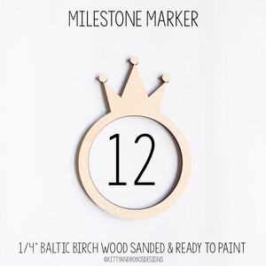 May include: A wooden milestone marker with a crown on top and the number 12 in the center. The marker is 1/4 inch thick and made of Baltic birch wood. It is sanded and ready to paint.