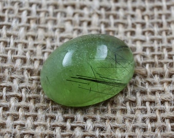 24ct Natural Peridot Gemstone, Oval Cabochon Cut with Ludwigite Inclusions - 21x15mm