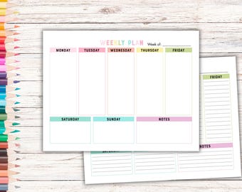 May include: A white weekly planner with pastel color accents. The planner is labeled "WEEKLY PLAN" and includes sections for each day of the week, plus "NOTES". A smaller planner with lined pages is also visible.