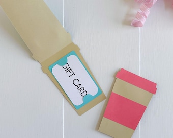 May include: A tan gift card holder with a blue gift card that reads "GIFT CARD". A paper coffee cup with a pink band and lid is next to the holder. The top of the image reads "SVG • DXF • PNG • JPG".
