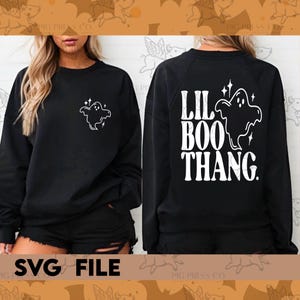 May include: Black sweatshirt with a white ghost graphic on the front and the text "Lil Boo Thang" on the back.