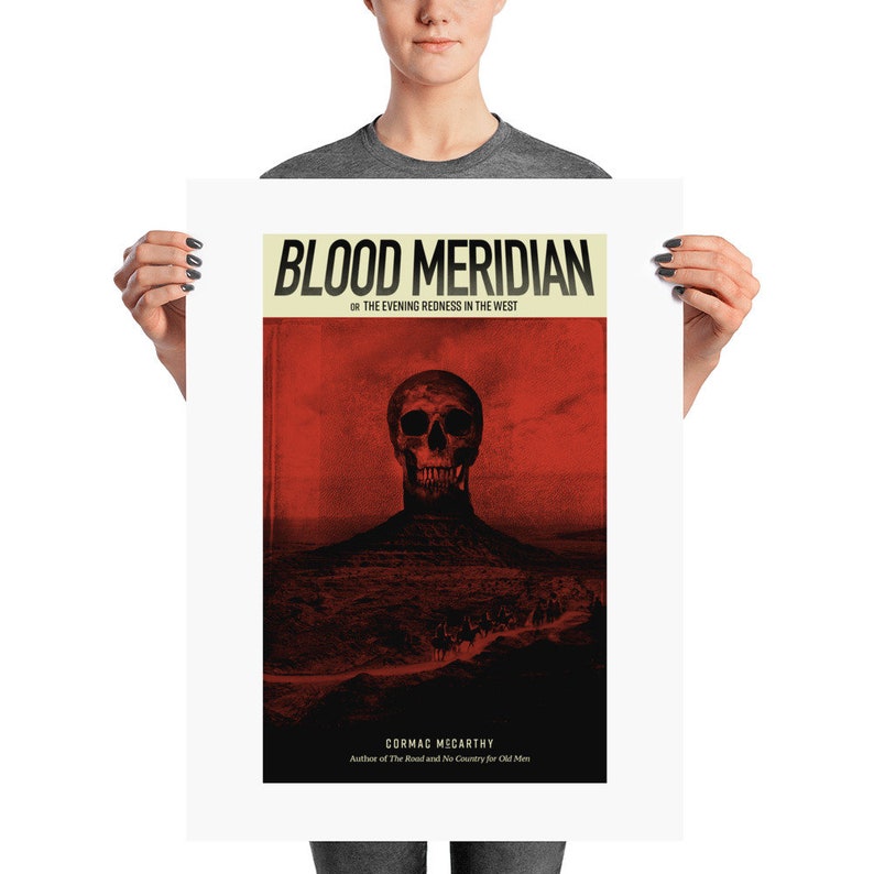 May include: A poster for the book "Blood Meridian or The Evening Redness in the West" by Cormac McCarthy. The poster features a red skull against a red and black background.