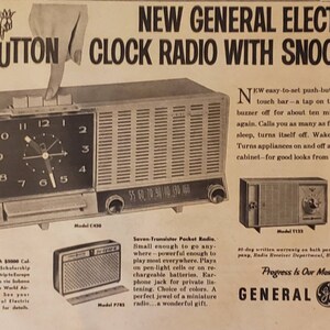 May include: A vintage advertisement for General Electric push-button clock radios with a snooze alarm feature. The ad features a close-up of the radio with a clock face and push buttons. The text reads "New General Electric Push-Button Clock Radio with Snooz-Alarm".