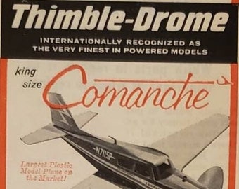 May include: A vintage advertisement for Thimble-Drome model airplanes. The ad features two planes, the Comanche and the PT-19 Flight Trainer. The Comanche is a large, white and blue plane with a 32-inch wingspan. The PT-19 is a smaller, gray and white plane with a 22-inch wingspan. The ad also includes a picture of a fuel bottle and text about the planes' features and performance.
