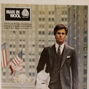 May include: A black and white advertisement for Cricketeer clothing featuring a man in a gray pinstripe suit with a white shirt and a tie. The text reads "A man's personal style comes through in Cricketeer clothing. Cricketeer suit with soft shoulder, 2-button, center vent design. Tailored of wool. It's worth more. Naturally. Cricketeer"