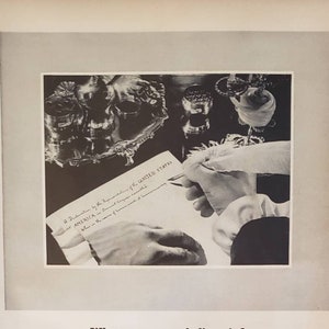 May include: A black and white photo of a person writing on a piece of paper with a quill pen. The paper has the text "A Declaration by the Representatives of the UNITED STATES OF AMERICA, in General Congress assembled." The photo is a vintage advertisement for E.R. Squibb & Sons, a pharmaceutical company. The ad text reads "What can a man believe in?" and "The priceless ingredient of every product is the honor and integrity of its maker."