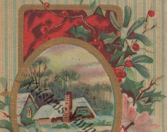 May include: A vintage Christmas card with a gold oval frame depicting a snowy cottage with a chimney. The frame is surrounded by holly and berries with a white flower on the right side. The card has a blue and white striped background and the text "A Merry Christmas."