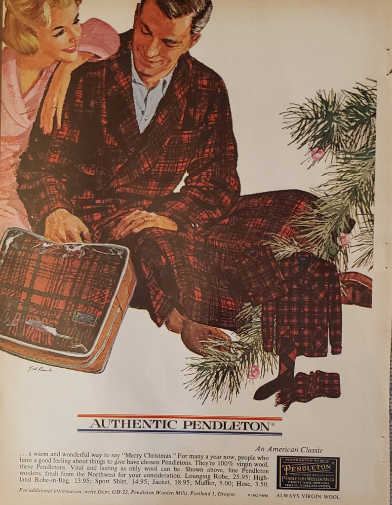 May include: A couple sits by a Christmas tree. The man is wearing a red and black plaid Pendleton robe. The text on the ad reads "Authentic Pendleton, An American Classic, Always Virgin Wool".