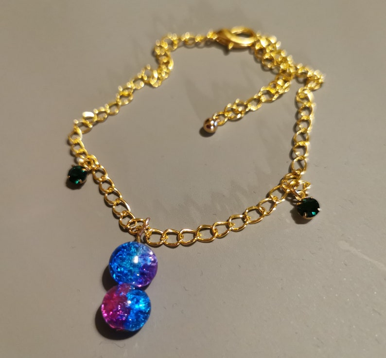 One piece bracelet anklet with a beads charm and small green rhinestones