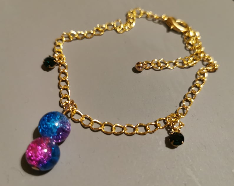 One piece bracelet anklet with a beads charm and small green rhinestones