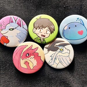Buttons featuring Fel, Mukouda, Sui, Dora-chan, and Gonji individually.