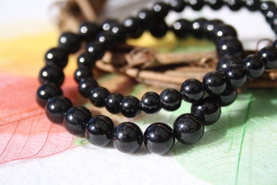 STONE BEAD BRACELET 6 MM SHINY BLACK W/GOLD STONE BEAD BRACELET 6 MM SHINY BLACK W/GOLD