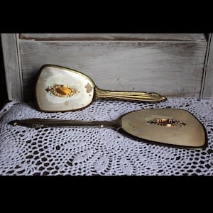 Antique handbrush and mirror