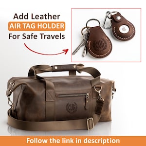 May include: A brown leather duffel bag with a zipped front pocket, a top handle, and a detachable shoulder strap. The bag features a monogram with the letters CUG. Two brown leather AirTag holders are shown with metal key rings and clips.