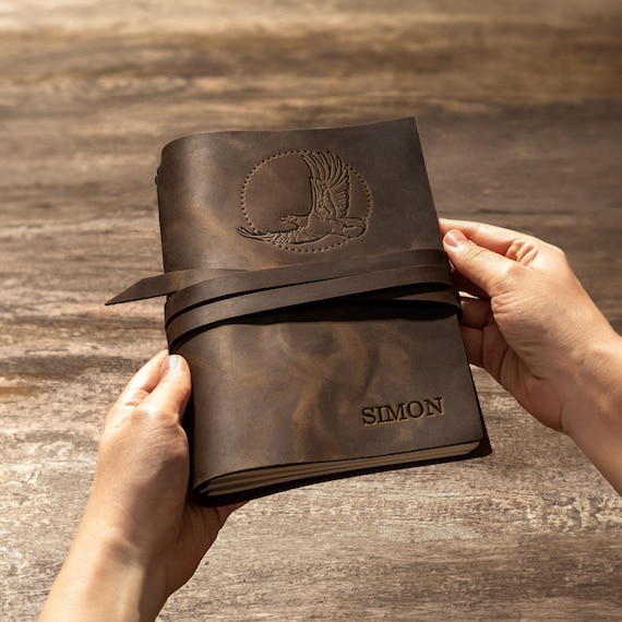 Genuine leather journal with custom embossed name or monogram — the kind of tactile, heirloom-feel gift that makes unboxing feel like a ceremony.