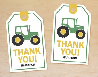 May include: Two white gift tags with a green tractor illustration and the words "THANK YOU!" in yellow. The name "HARRISON" is printed below. Each tag has a yellow hole reinforcement.