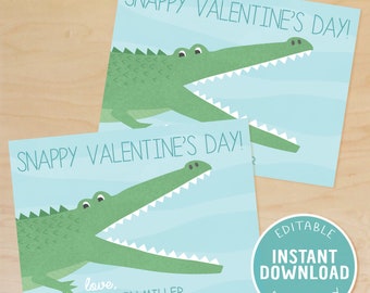 Op de afbeelding: Afdrukbare Valentijnskaart met een groene alligator met zijn bek open, op een lichtblauwe achtergrond. De tekst "Snappy Valentine's Day!" is geschreven in een blauw lettertype. De kaart is bewerkbaar en bevat de tekst "love, CAMERON MILLER".