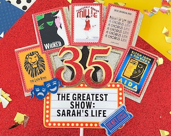 May include: A red and gold cake topper with the number 35, a marquee sign that says "The Greatest Show: Sarah's Life", and images of Broadway shows including Wicked, The Lion King, Thoroughly Modern Millie, A Chorus Line, and Aida.