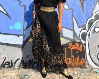 Long skirt in black organza straight cut and ruffles on the bottom decorated with gold and copper thread lace- golden elasticated belt- Sublime!