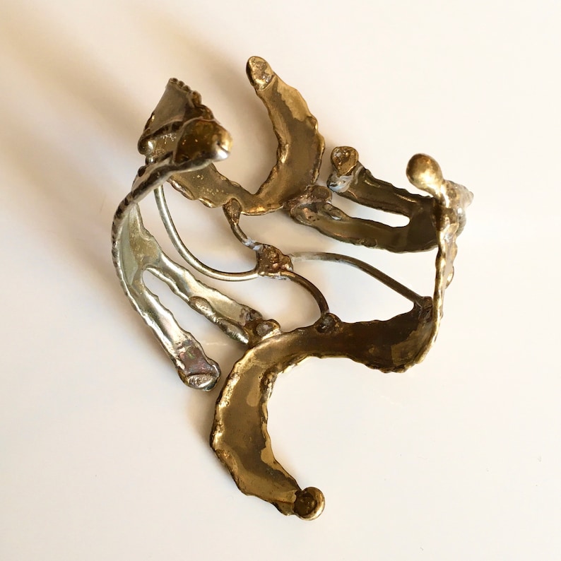 Unique piece and adjustable to all wrists Like an abstract sculpture Open cuff bracelet in goldsilver metal