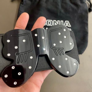 Sonia Rykiel Paris- Wide belt, elasticated high waist adorned with an imposing black lacquered resin bow with rhinestones- Adjustable