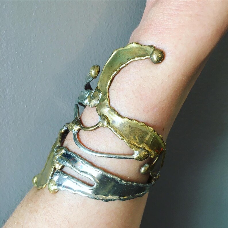 Unique piece and adjustable to all wrists Like an abstract sculpture Open cuff bracelet in goldsilver metal