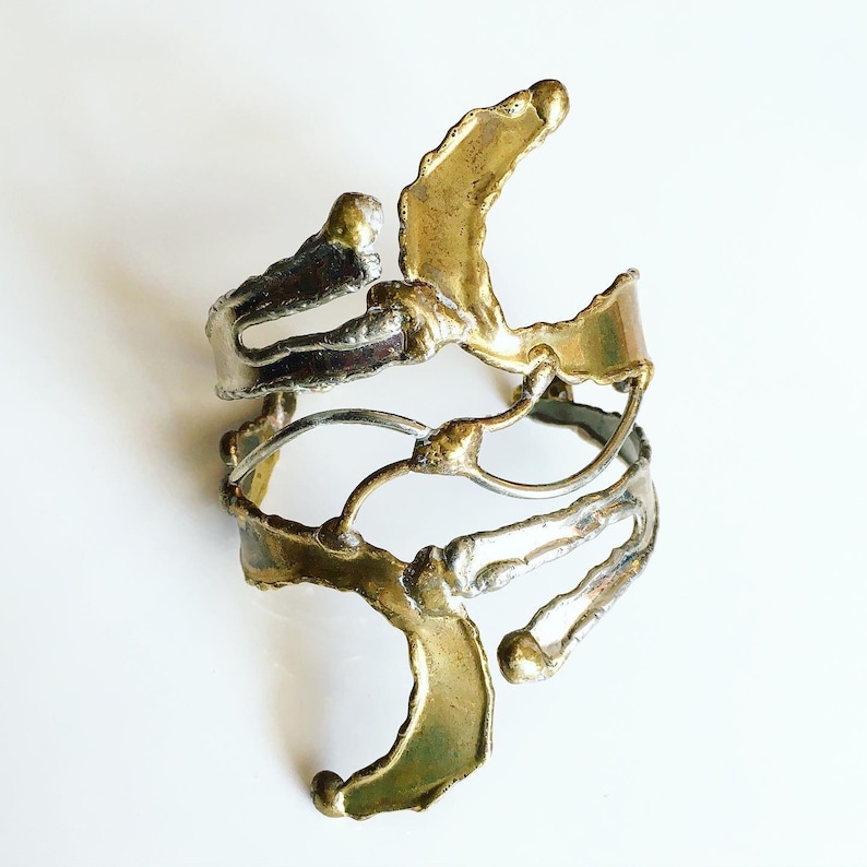 Unique piece and adjustable to all wrists Like an abstract sculpture Open cuff bracelet in goldsilver metal