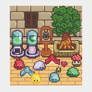 May include: A cross-stitch pattern featuring pixelated game elements including two glass capsules with glowing contents, a wooden sign, a potted tree, a red mushroom, a small pink heart, and several colorful blob-like creatures on a tiled floor.