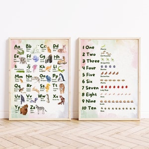May include: Two framed educational posters. One displays the alphabet with animal illustrations, such as an alligator for 'A' and a zebra for 'Z'. The other poster shows numbers one through ten with corresponding illustrations of insects and animals.