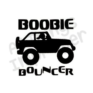 May include: Black graphic of a jeep with the words "BOOBIE BOUNCER" in bold, uppercase letters. The jeep has large tires and a spare tire on the back. A person is visible in the driver's seat.