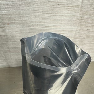 May include: A clear plastic vacuum seal bag with a zip closure. The bag is empty and ready to be used for food storage.