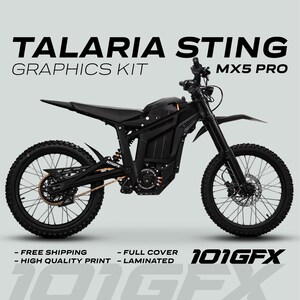 May include: Black Talaria Sting MX5 Pro graphics kit. The image shows a black electric dirt bike with the text "TALARIA STING GRAPHICS KIT MX5 PRO" and "101GFX". The bike has black tyres, a black frame, and gold chain.