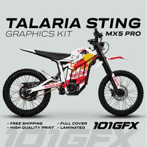 Pode incluir: Kit gráfico Talaria Sting MX5 Pro branco, vermelho e amarelo. O kit apresenta o logotipo da Red Bull e o texto "TALARIA STING GRAPHICS KIT". O kit inclui cobertura total e é laminado. O texto "101GFX" também é visível.