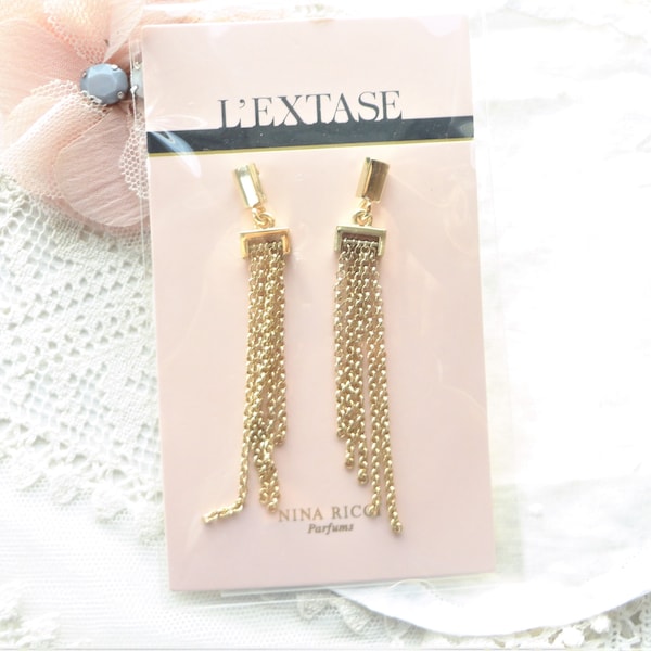 boucle d'oreille Nina Ricci neuve, pendant moderne,bijoux haute couture,  clou, oreille, doré,