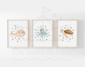 Set med 3 barnposters med havstema för väggdekoration i barnrum, med akvarell illustrationer av ett hav, en val, en bläckfisk och en sköldpadda.